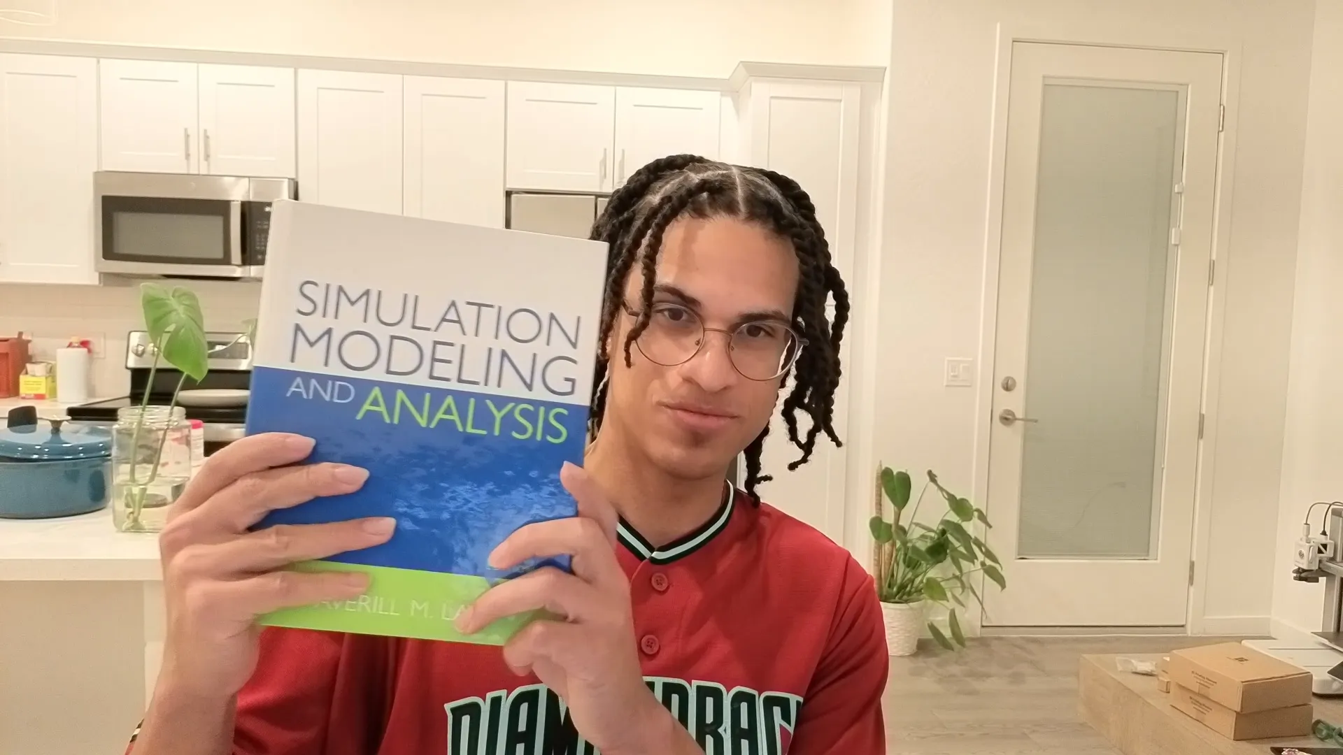 Edimar holding a simulation book